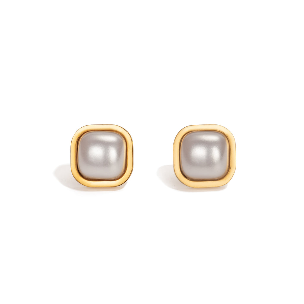 Minimalist square stud earrings featuring soft-edged, glossy pearl centre set in sleek gold-tone frames; a refined and romantic design capturing the quiet elegance and nostalgic soul of the Hopeless Romantic Society brand
